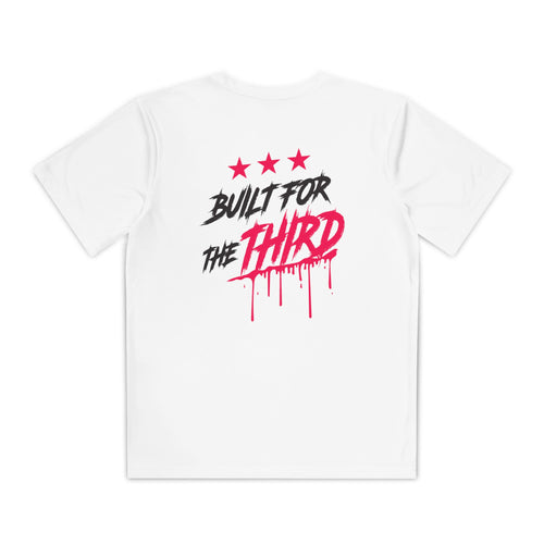A white youth athletic tee featuring bold black and pink text on the back that reads BUILT FOR THE THIRD, accompanied by three red stars and a dripping paint effect. The shirts design emphasizes movement and a streetwise attitude.